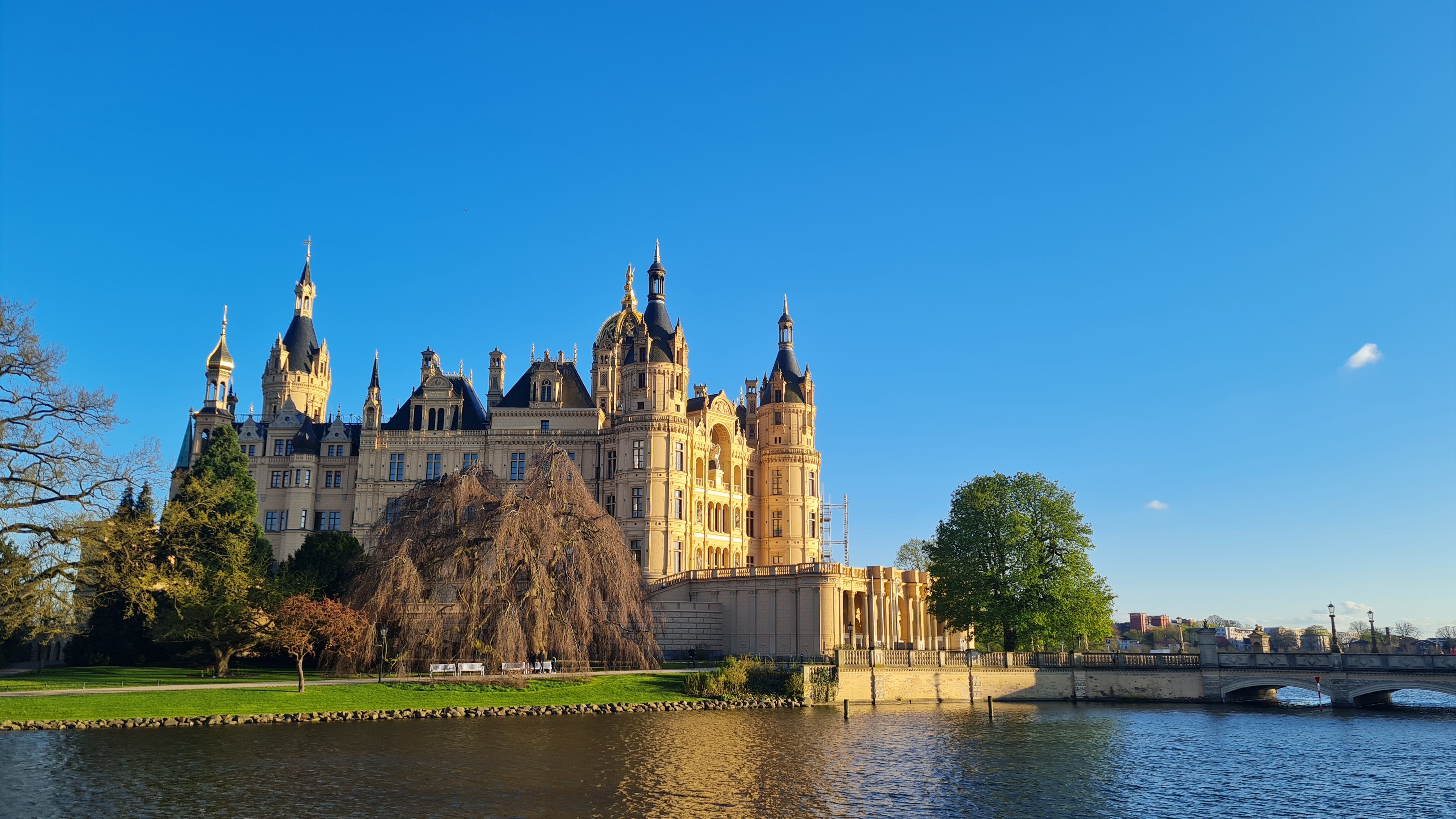 Schwerin Palace rising above the lake on a sunny day, Germany