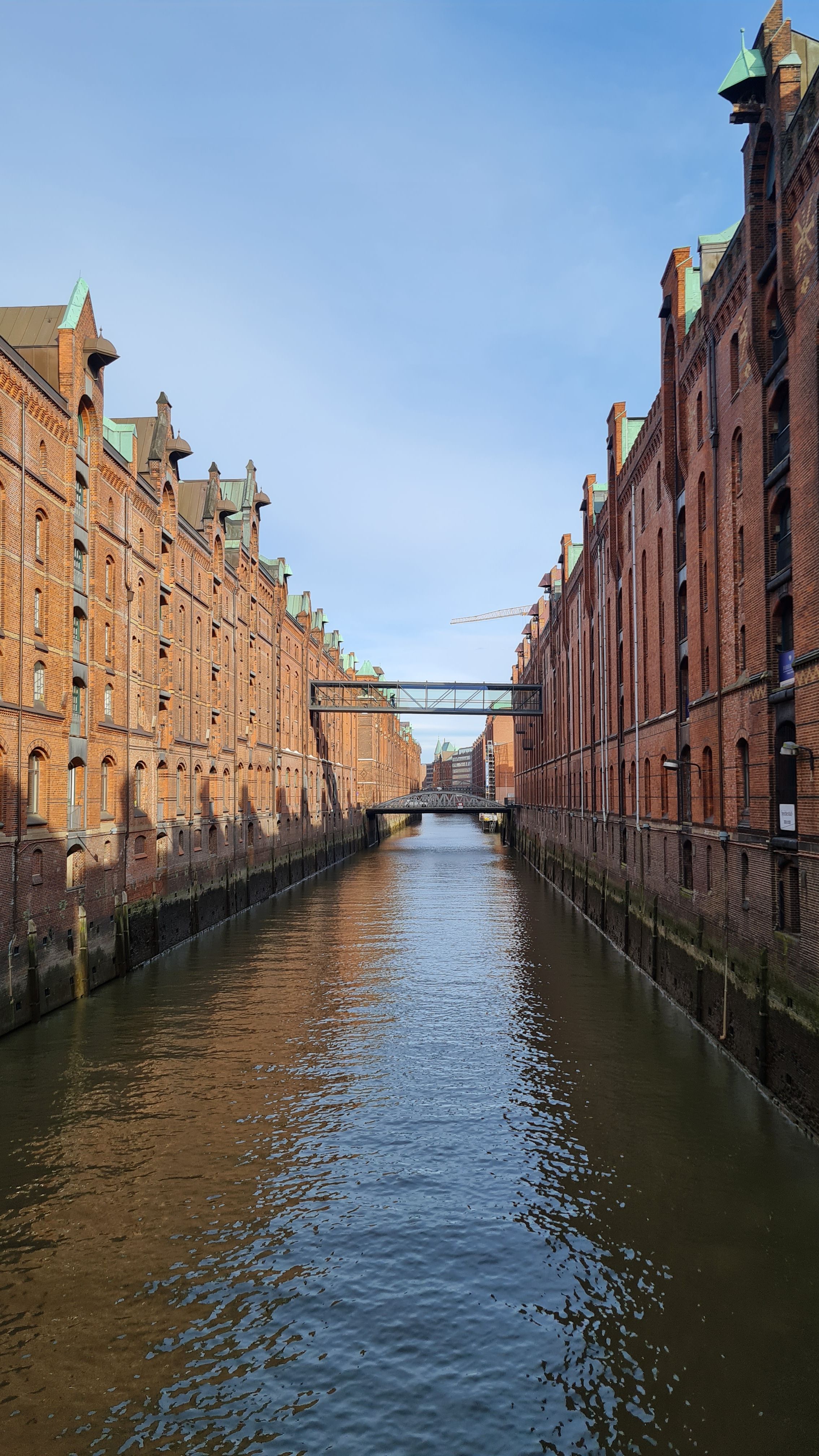 Row of red-brick Speicherstadt warehouses along a canal, Hamburg